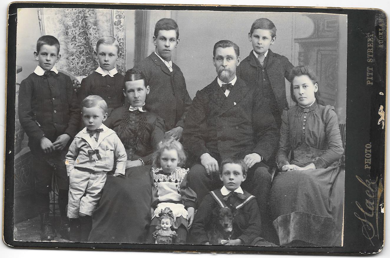 Hunter May Hughes with her doll and family