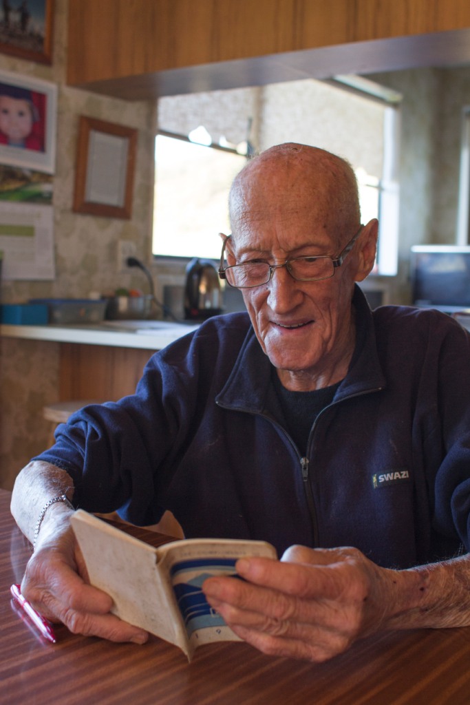  John Collins remembers his days harvesting mussels while looking at his mussel diary.[Lucy Stronach, 2015] 