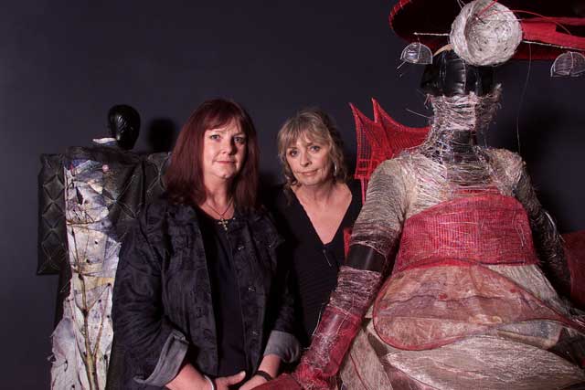 World of WearableArt’s Heather Palmer, left, and Suzie Moncrieff, surrounded by 