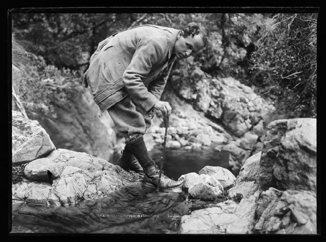 Roding River.  View of a man with measuring stick Nelson Provincial Museum 31107