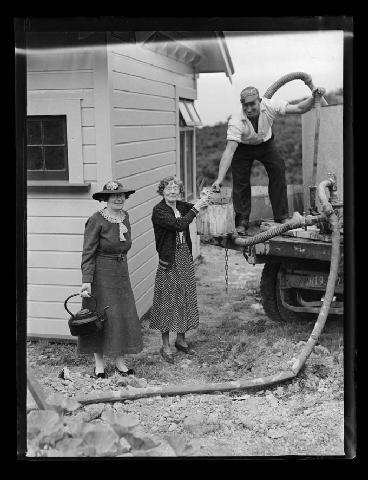 Water shortage. Distributing water from the back of a water truck.  Nelson Provi